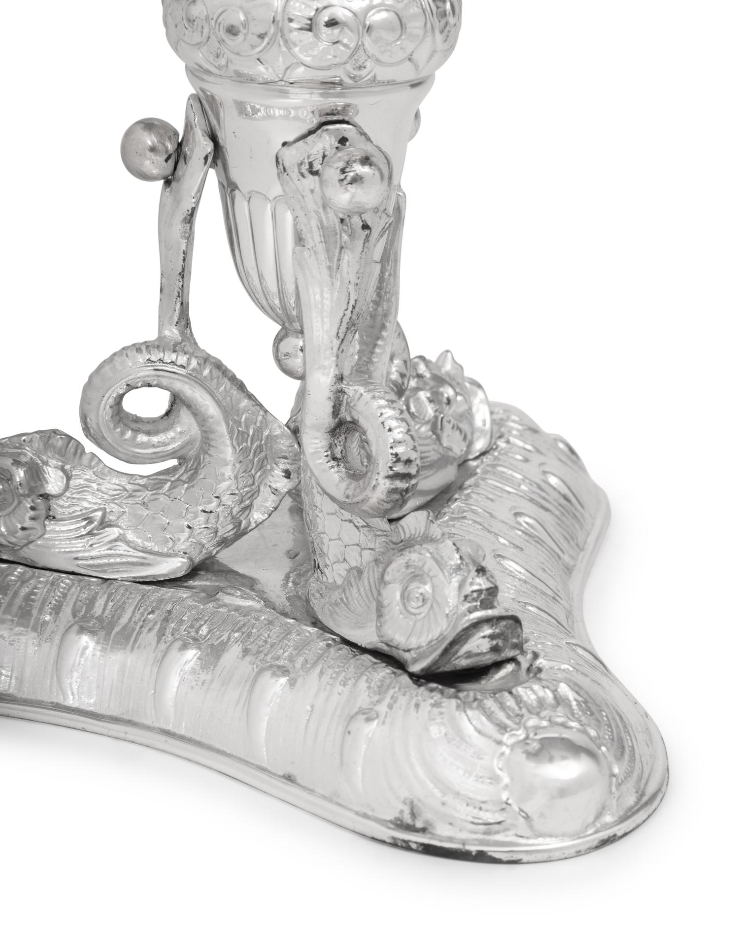 A Silver-Plate Dolphin Form Table Garniture