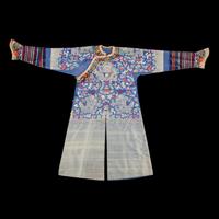 A Chinese Blue Ground Brocade 'Dragon' Robe, Jifu, Late Qing Dynasty 清晚期 藍地織錦云龍紋吉服