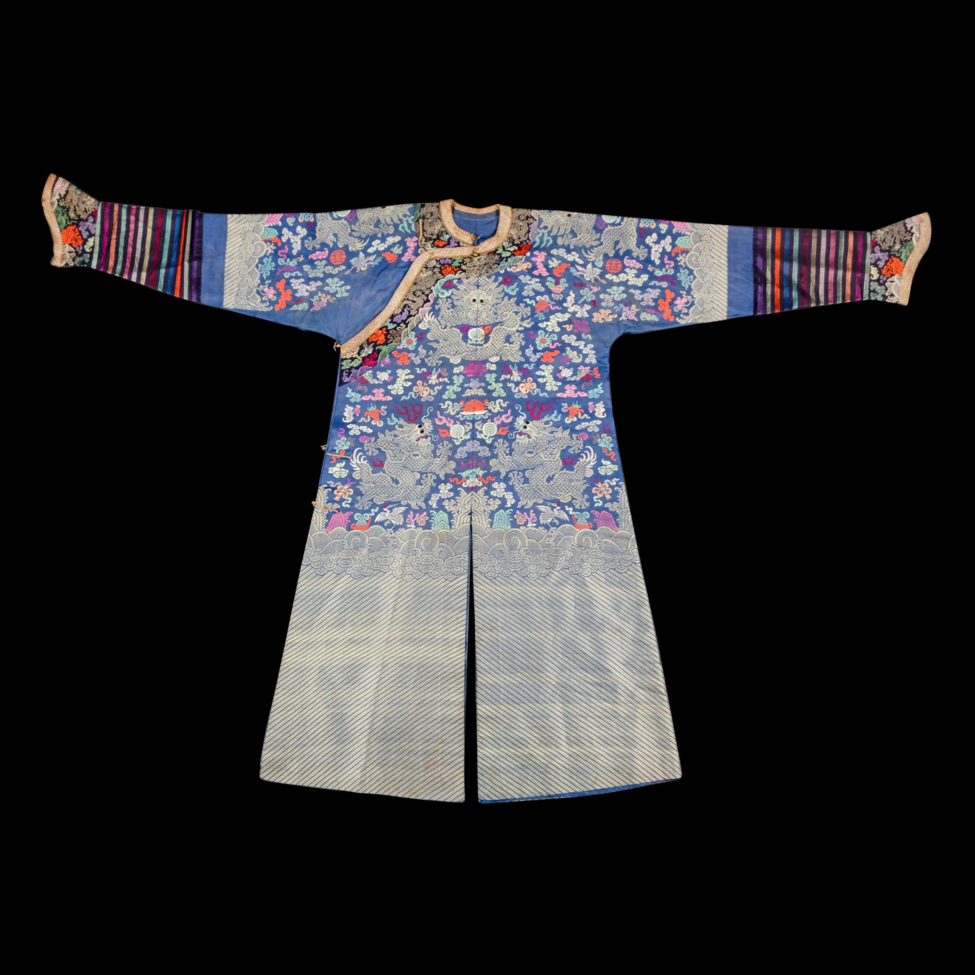 A Chinese Blue Ground Brocade 'Dragon' Robe, Jifu, Late Qing Dynasty 清晚期 藍地織錦云龍紋吉服