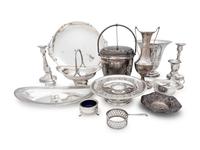 comprising a J. Wagner & Sons serving dish, Birks Silver Co. tazza, Tuttle Silversmiths vase, Dingwall sugar basket, Gorham nut dish, English bread dish and sauce boat, caster, salt cellar, three weighted candlesticks and a weighted vase, together with a silver-plate ice bucket. 15 items total.