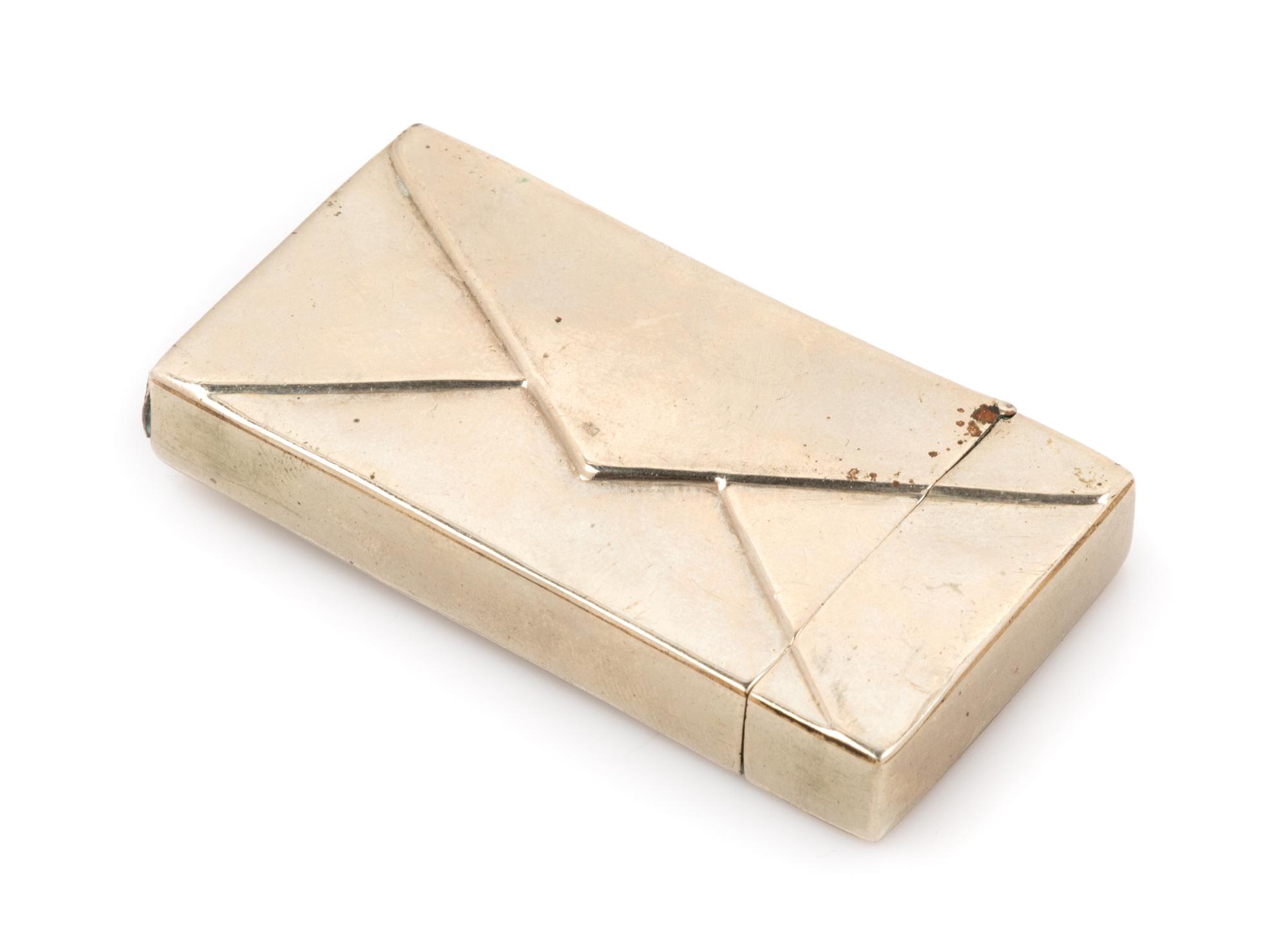 An American Silver Match Safe, Late 19th/Early 20th Century, in the form of a stamped envelope.