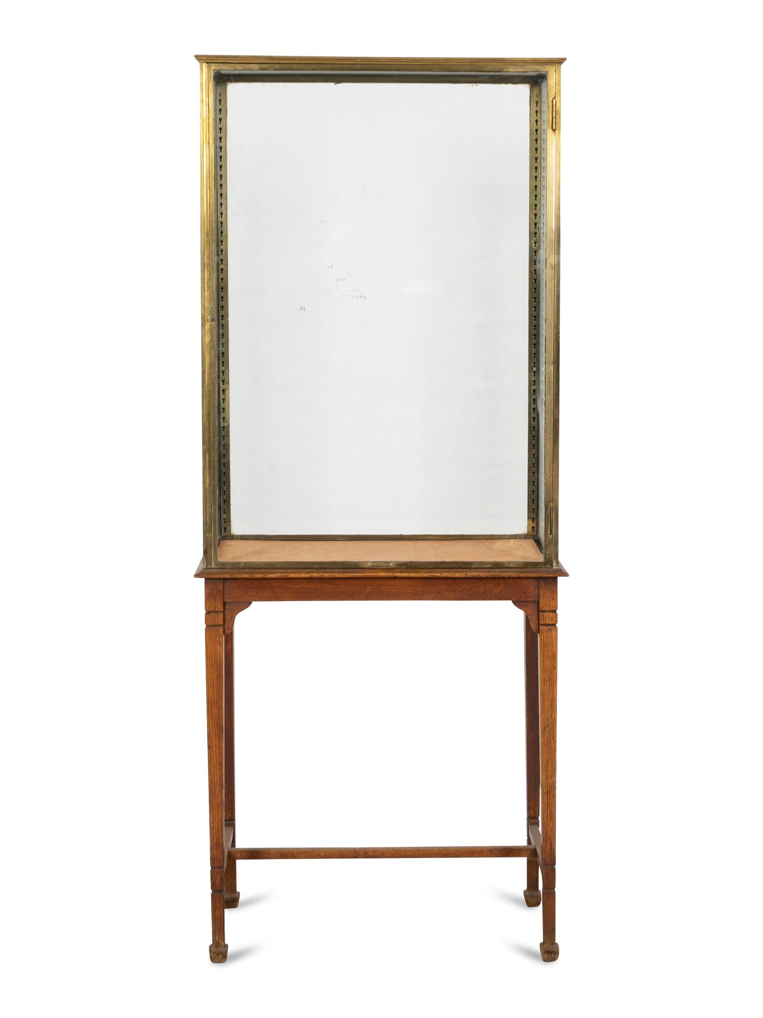 An A. Ravenel Parisian Brass and Glass Retailer's Window Vitrine on Oak Stand