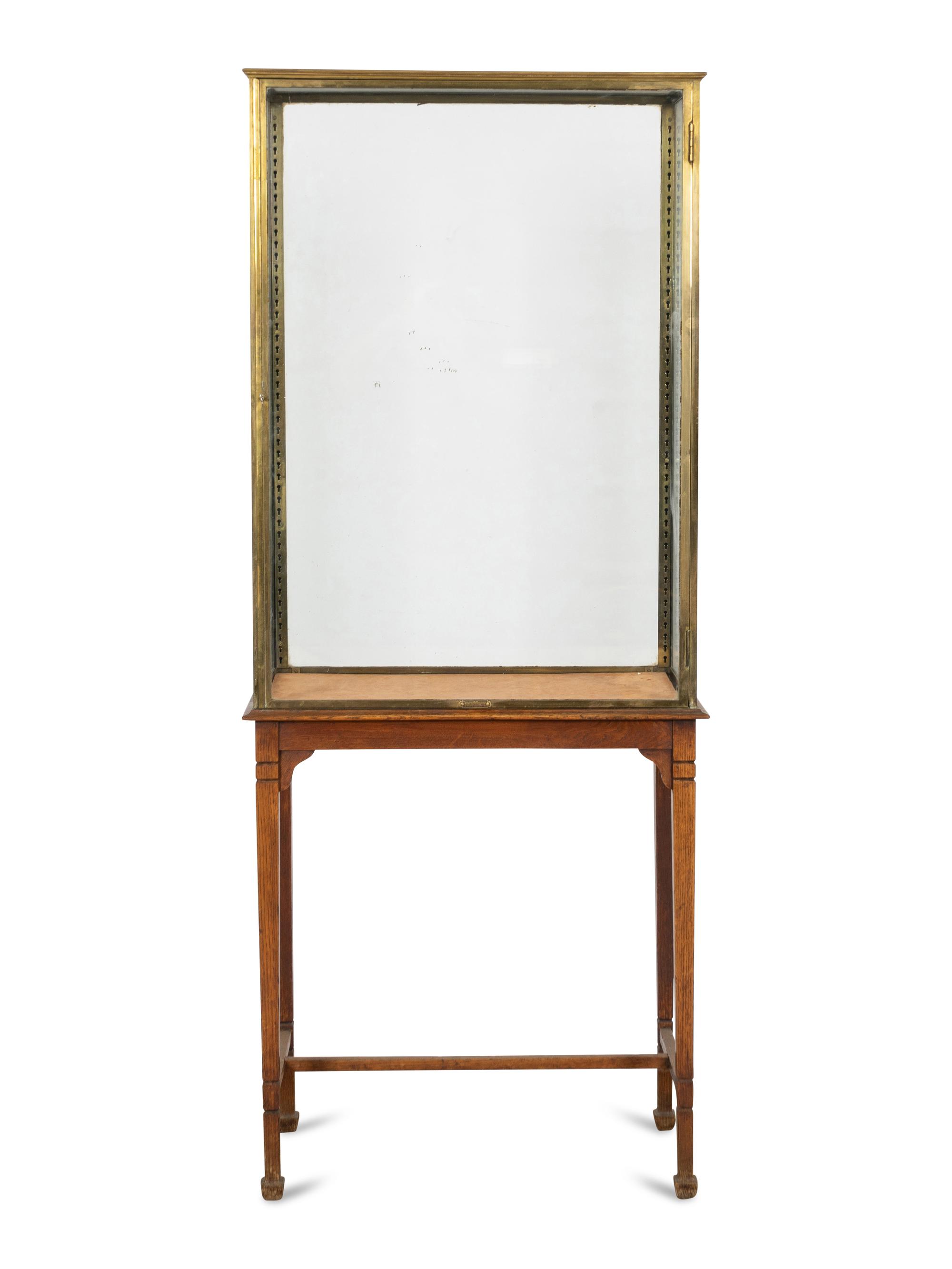 An A. Ravenel Parisian Brass and Glass Retailer's Window Vitrine on Oak Stand