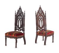 A Pair of Victorian Gothic Carved Walnut Side Chairs