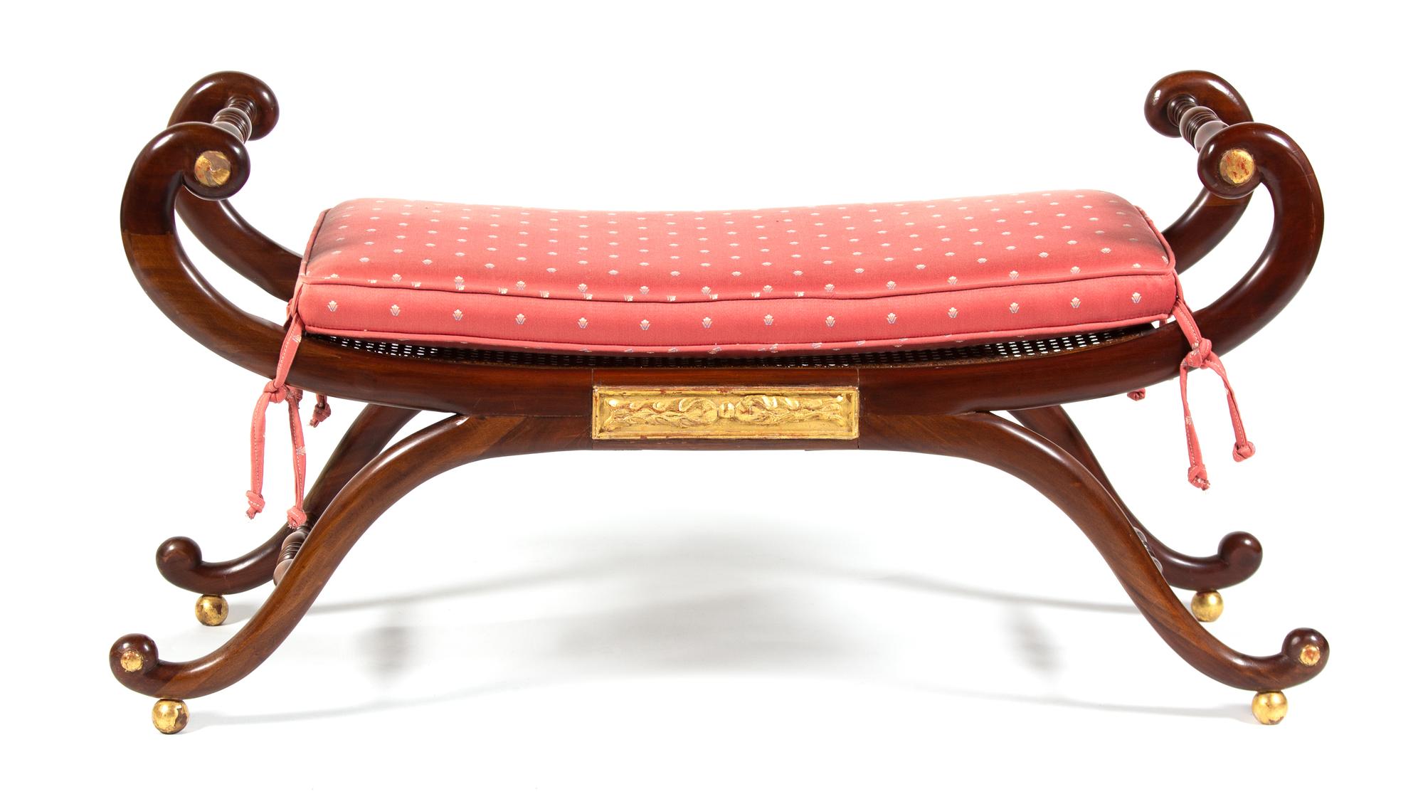 A Regency Style Parcel-Gilt Mahogany Curule-Form Window Bench Height 24 x width 45 inches. — 20TH CENTURY