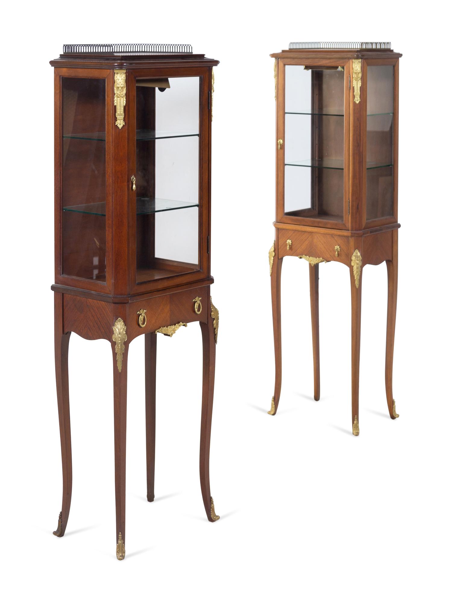 A Near Pair of Louis XV Style Gilt Bronze Mounted Vitrine Cabinets