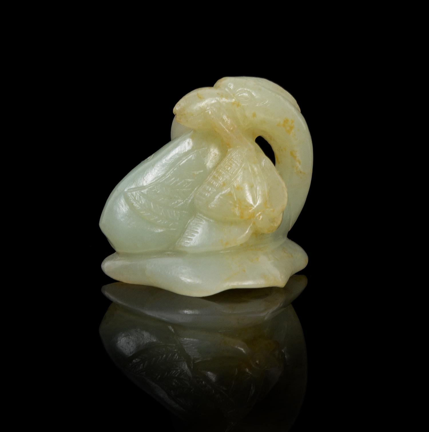 A Chinese Celadon Jade Model of a Goose 18TH/19TH CENTURY Width 1 7/8 x height 1 1/2 inches. — 18TH/19TH CENTURY