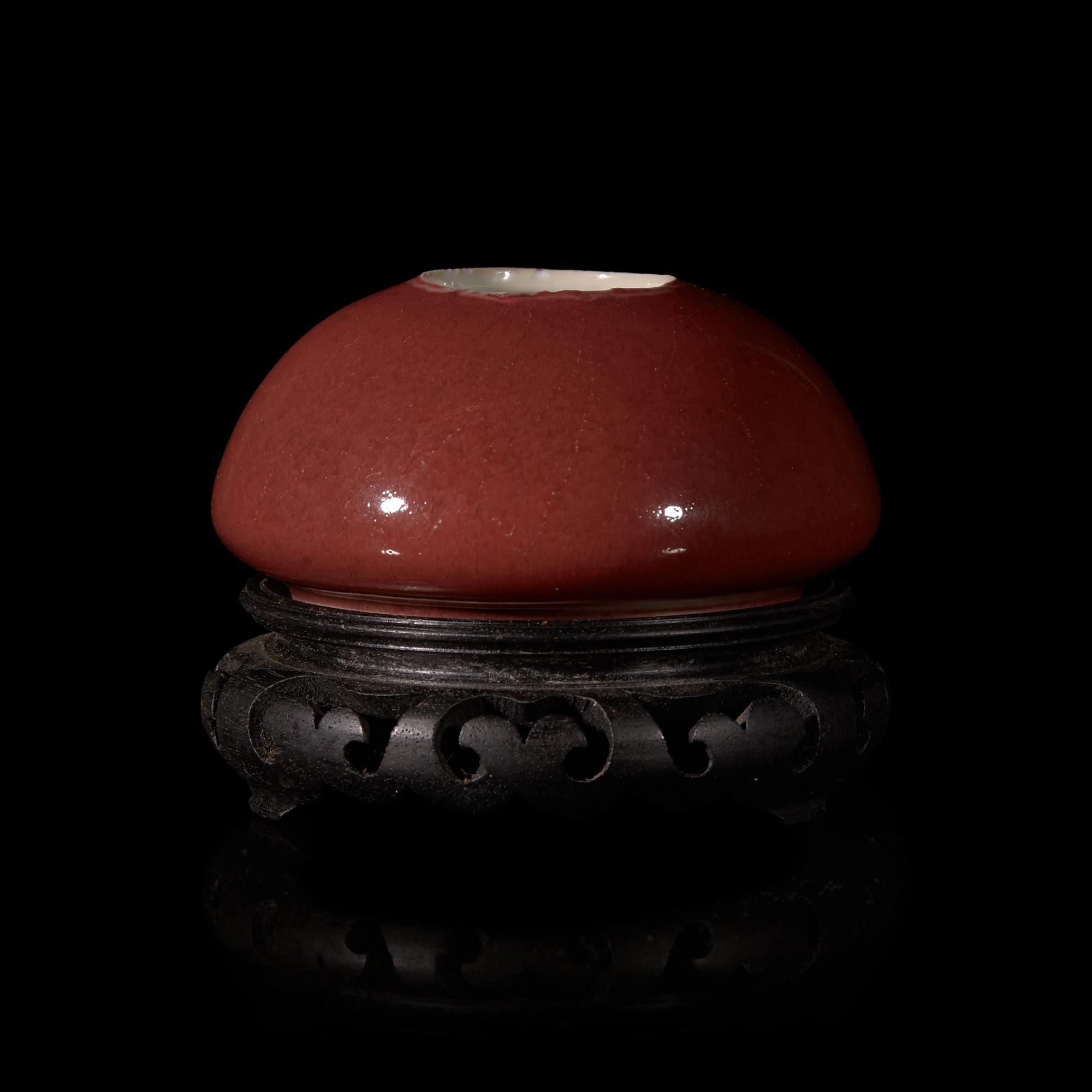 A Chinese Copper Red Glazed Water Coupe, 19th Century 清中晚期 霽紅釉雞心水丞