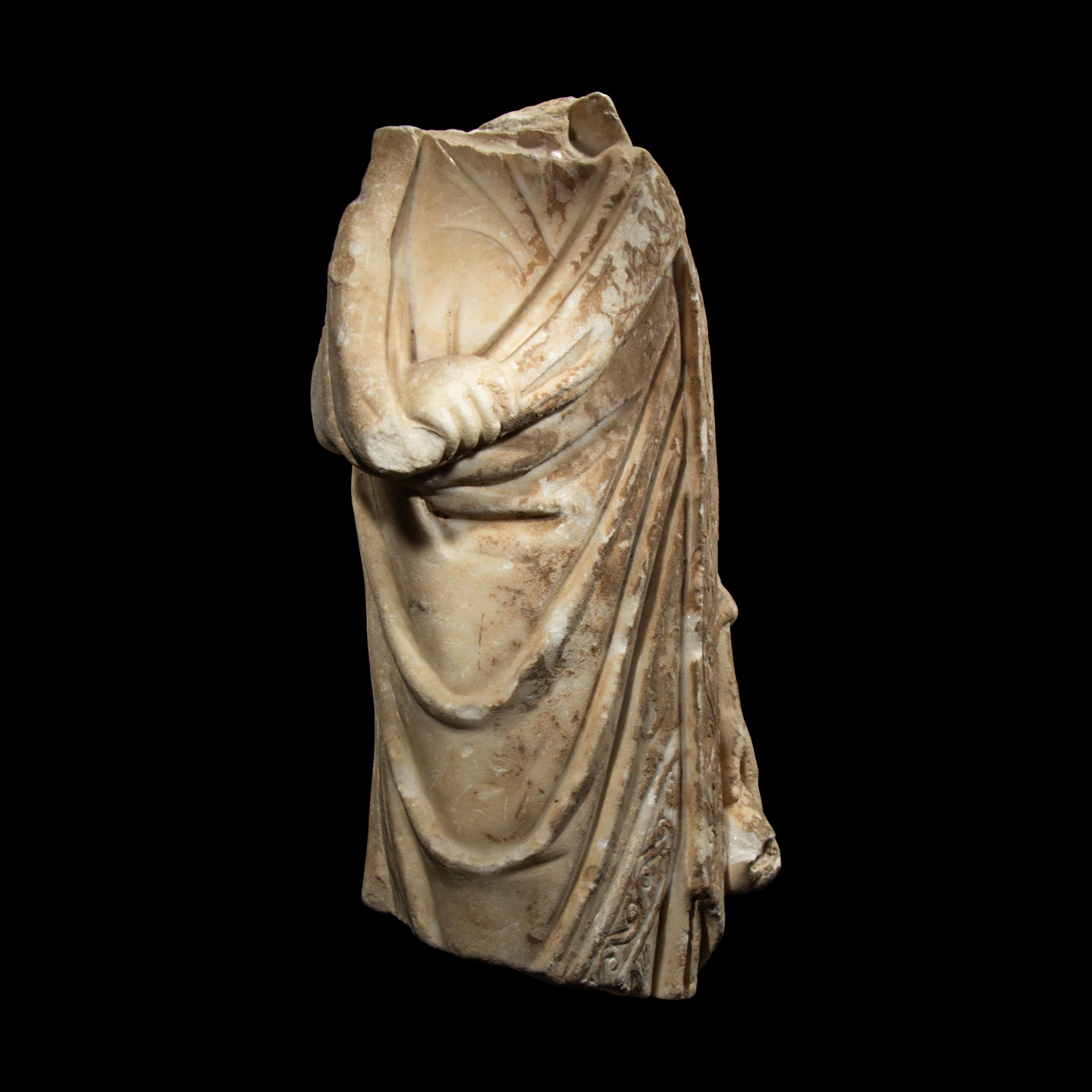 A Late Roman or Byzantine Marble Togatus Holding a Mappa