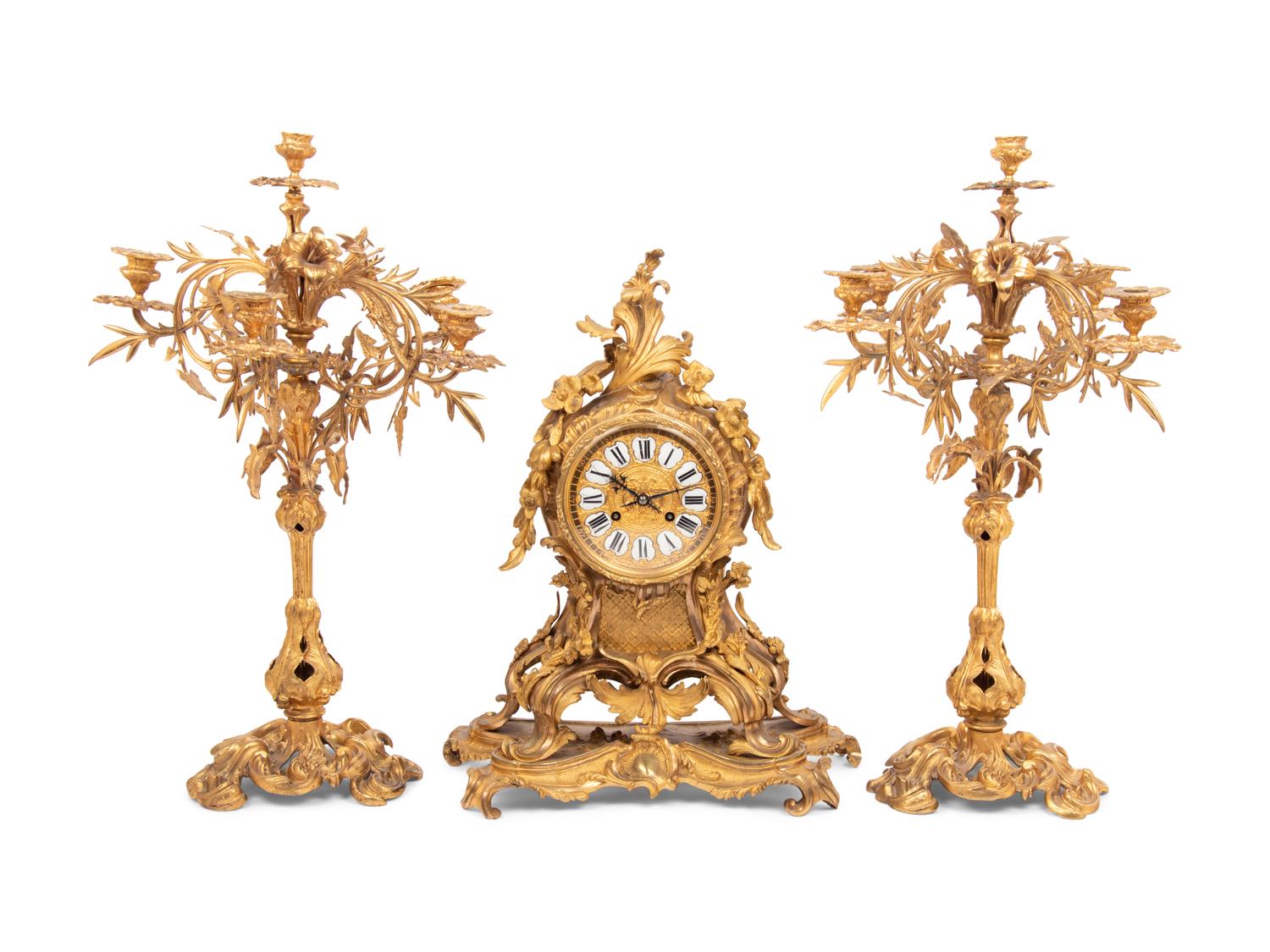 A Louis XV Style Gilt Bronze Clock Garniture