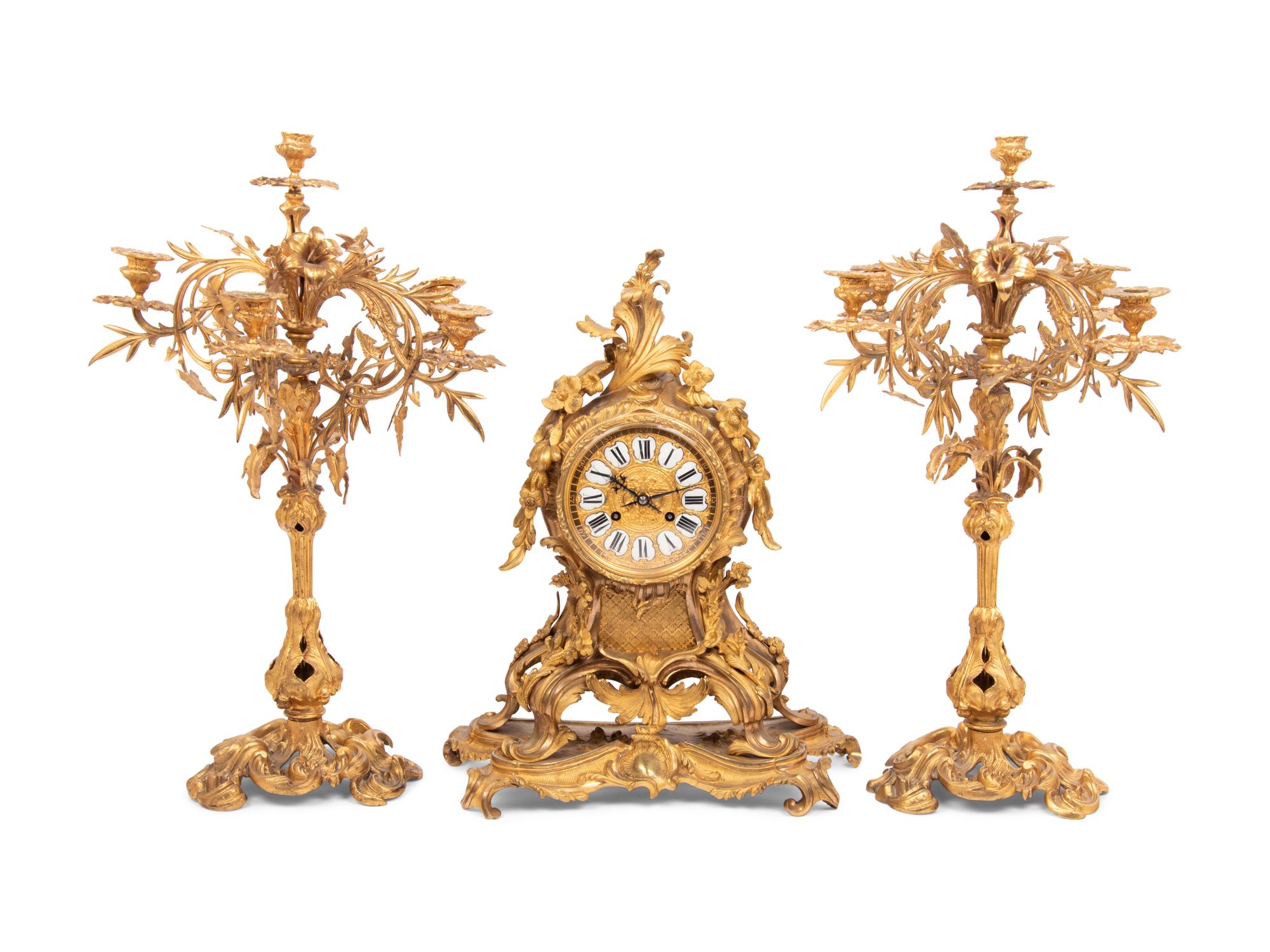 A Louis XV Style Gilt Bronze Clock Garniture