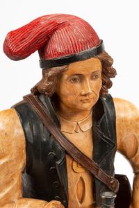 A Continental Painted Figure of a Man on a Barrel