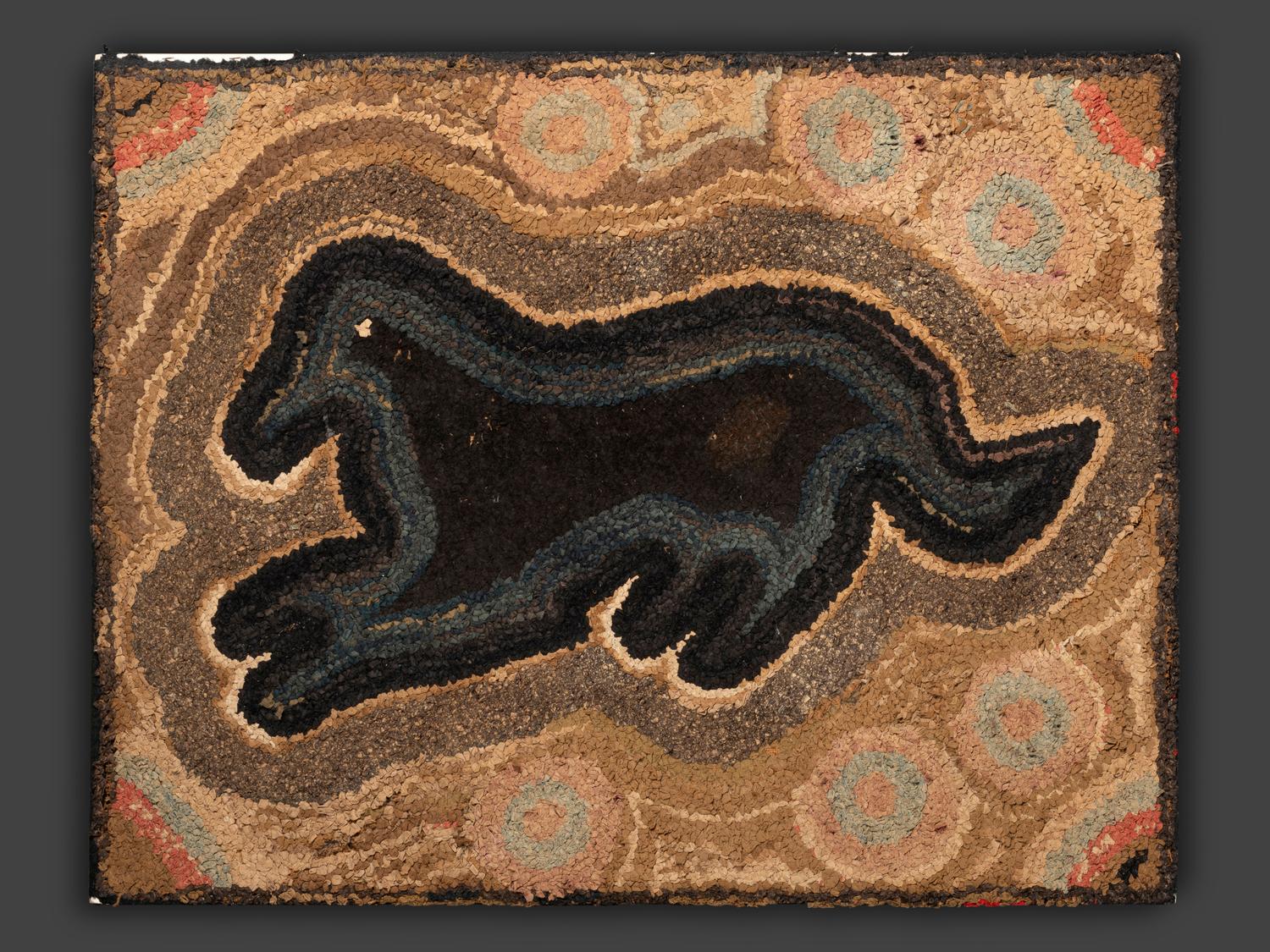 An American Hooked Rug with Black Dog