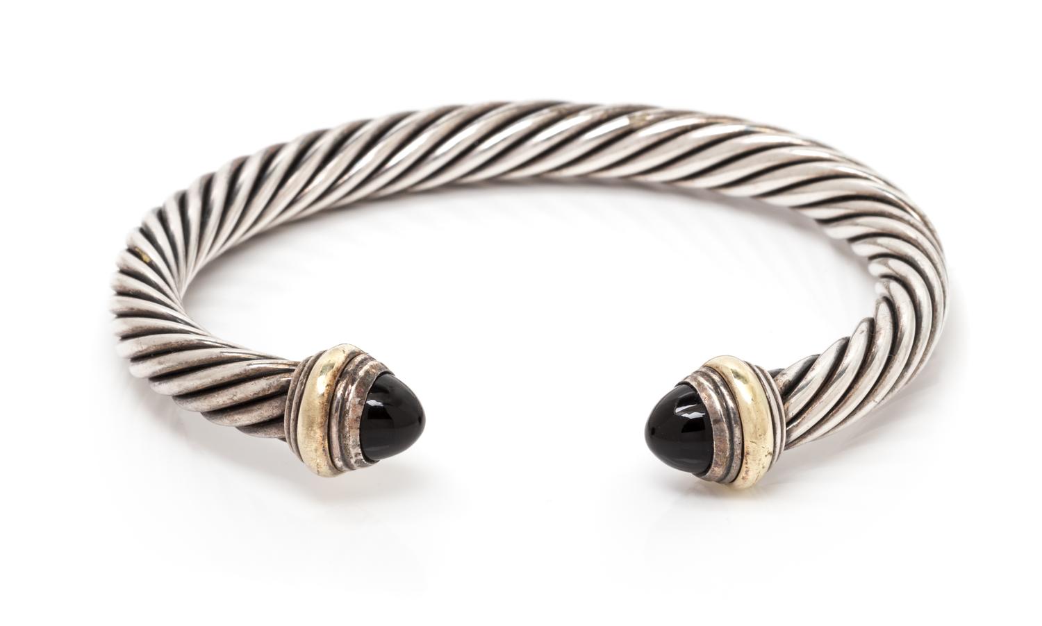 A Sterling Silver, 14 Karat Yellow Gold and Onyx 'Cable Classics' Bracelet, David Yurman, 28.50 dwts.