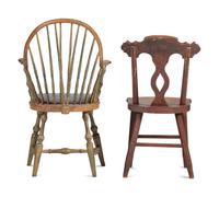 A Carved and Yellow-Painted Wood Leather Upholstered Brace Back Continuous Windsor Armchair