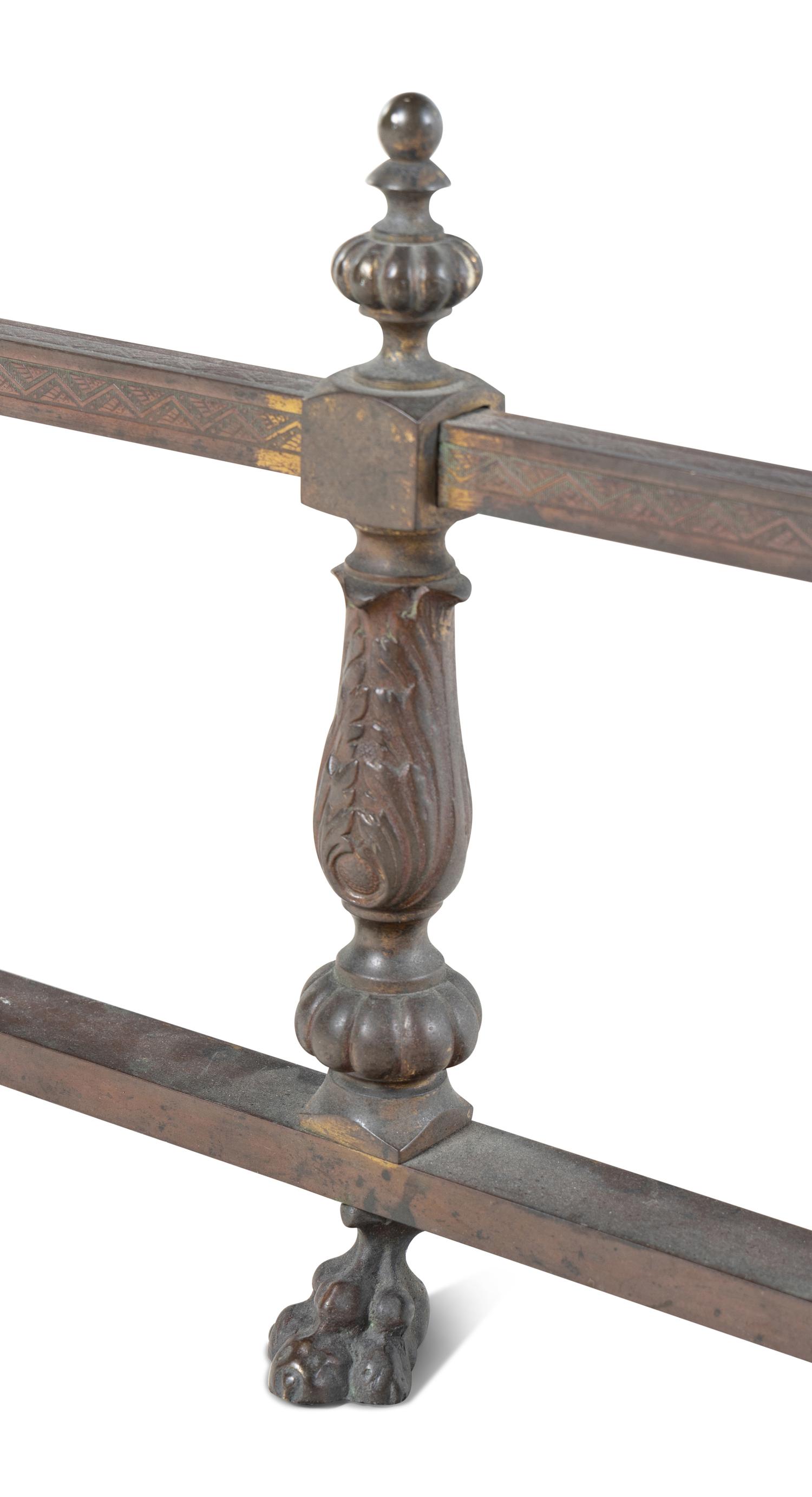 A Pair of Continental Brass and Iron Andirons and Fender