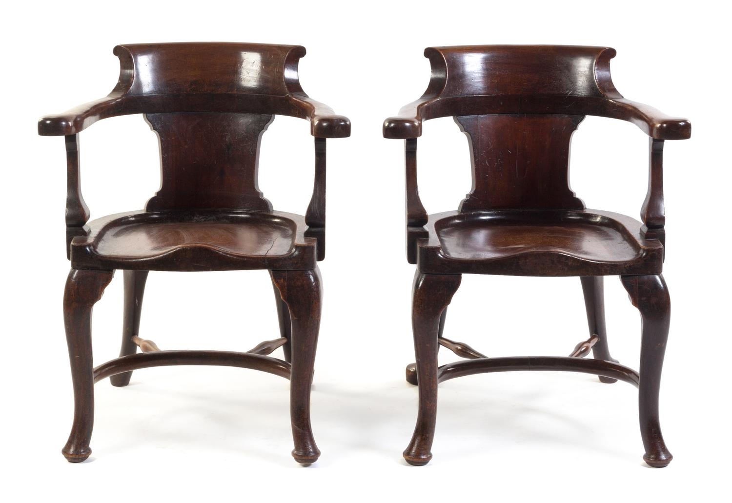 A Pair of English Mahogany Horseshoe Back Armchairs Height 33 1/2 inches.
