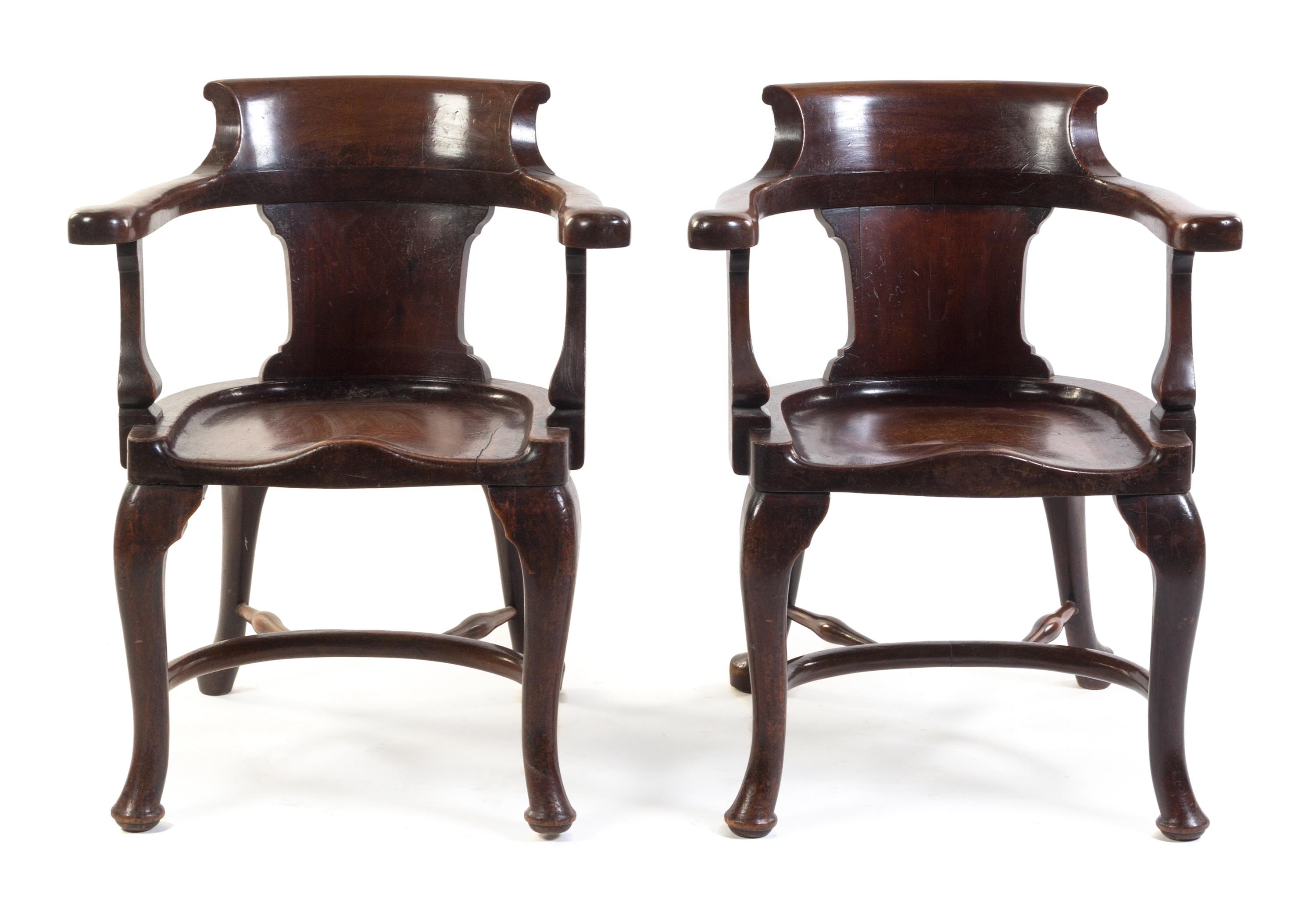 A Pair of English Mahogany Horseshoe Back Armchairs Height 33 1/2 inches.