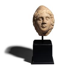 A Roman Marble Head of a Man Wearing a Phyrigian Cap