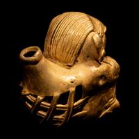 A Tairona Tumbaga Seated Female Figure