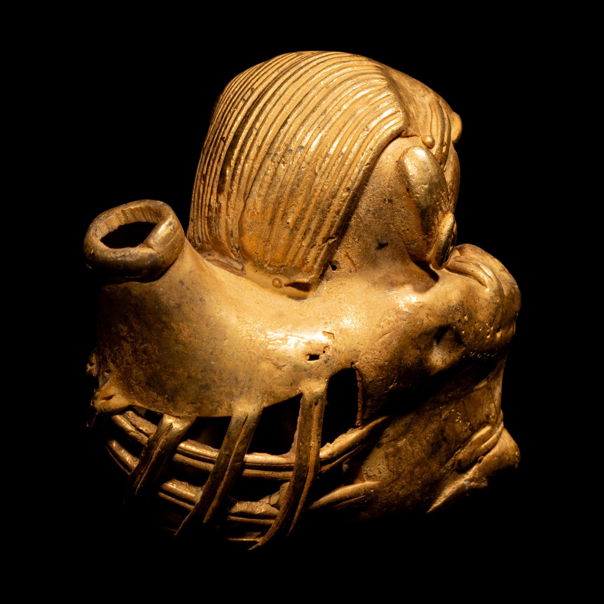 A Tairona Tumbaga Seated Female Figure