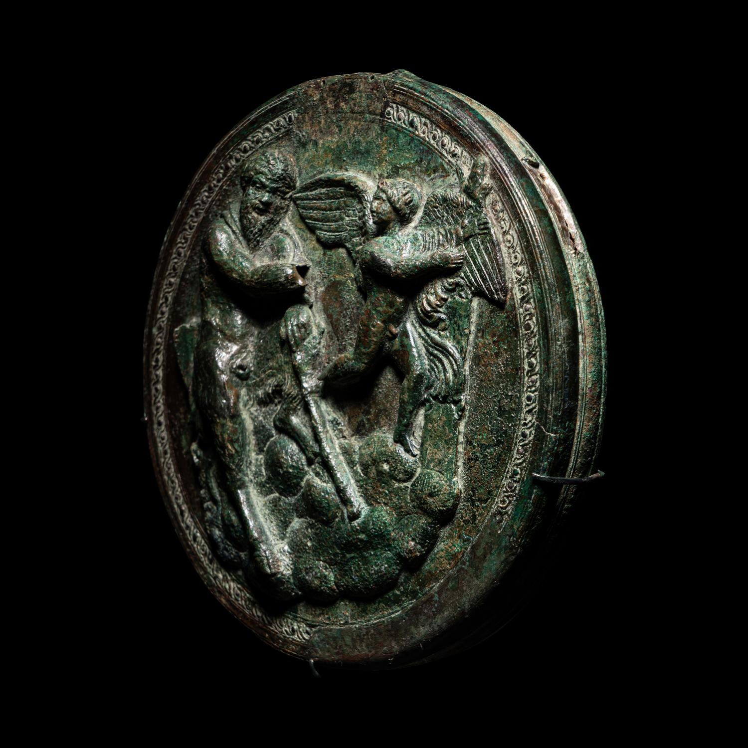 A Greek Bronze Box Mirror with Pan and Eros