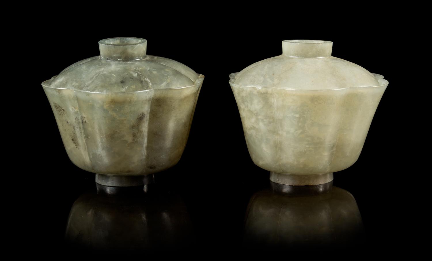 A Pair of Carved Celadon Jade Floriform Covered Bowls Height of taller 3 1/2 inches. — 19TH CENTURY