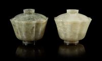 A Pair of Carved Celadon Jade Floriform Covered Bowls Height of taller 3 1/2 inches. — 19TH CENTURY