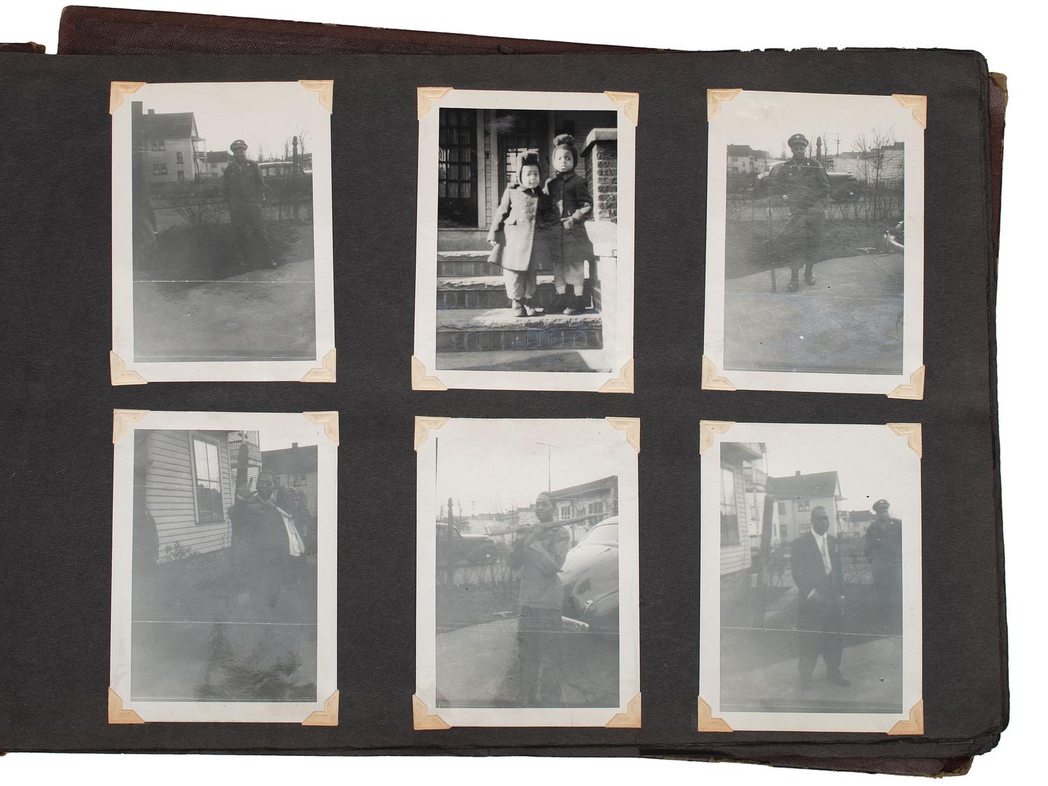 [WORLD WAR II]. Photo album and insignia belonging to an African American soldier.