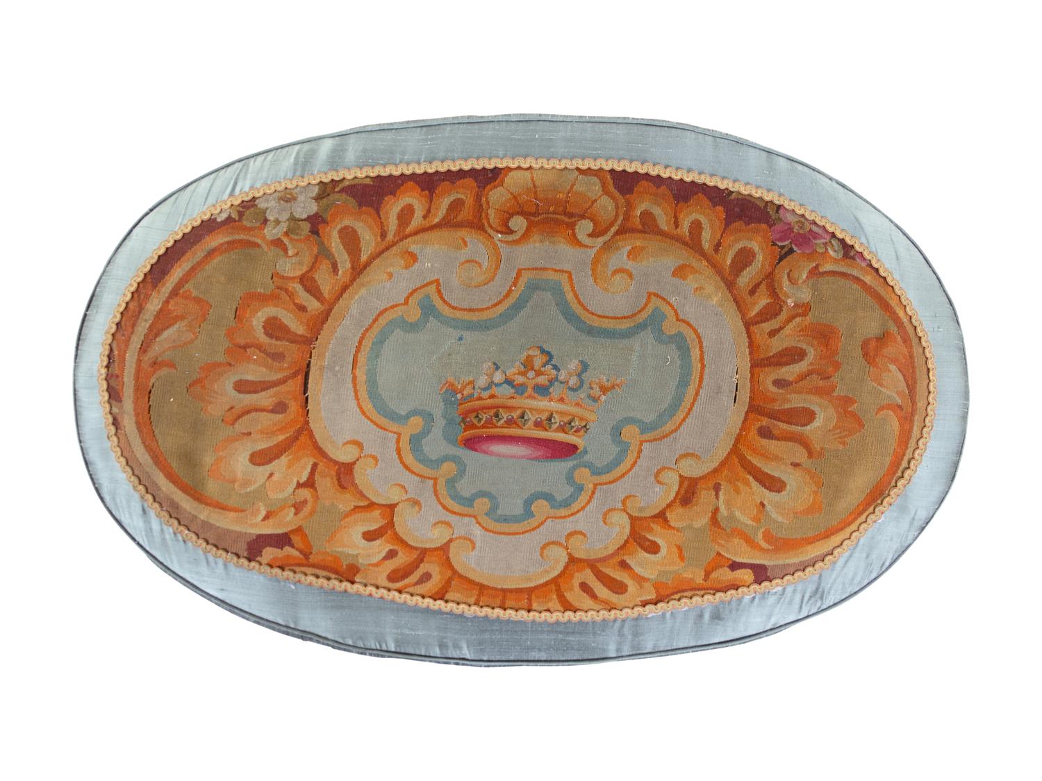 A French Needlepoint Upholstered Ottoman