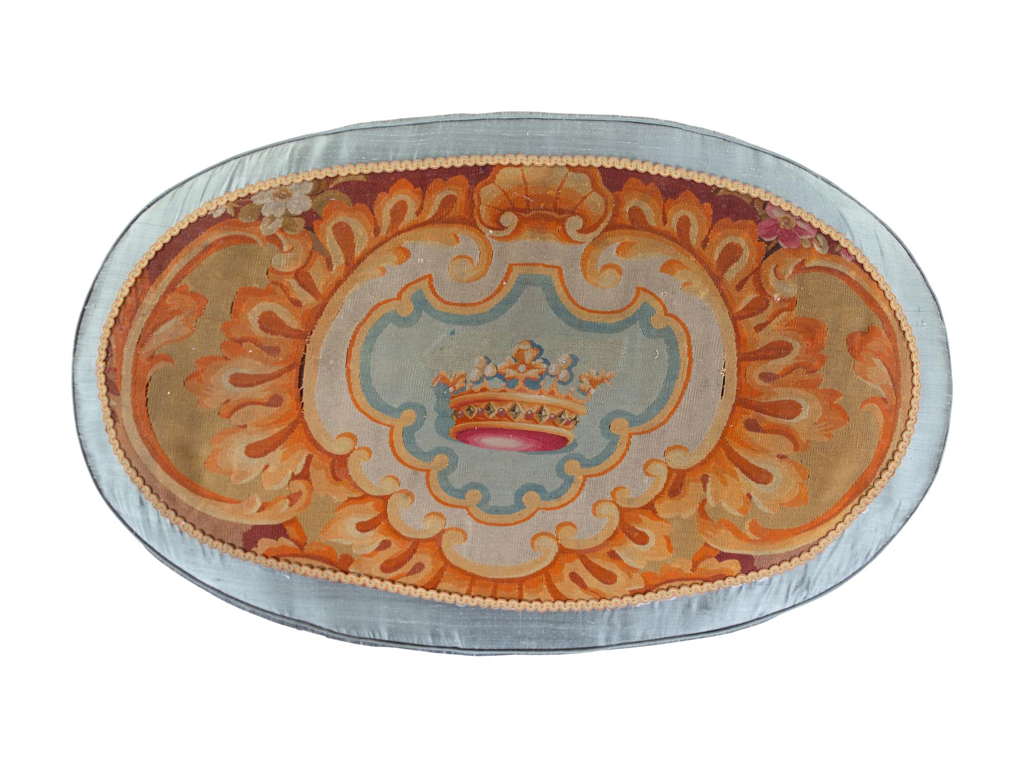 A French Needlepoint Upholstered Ottoman