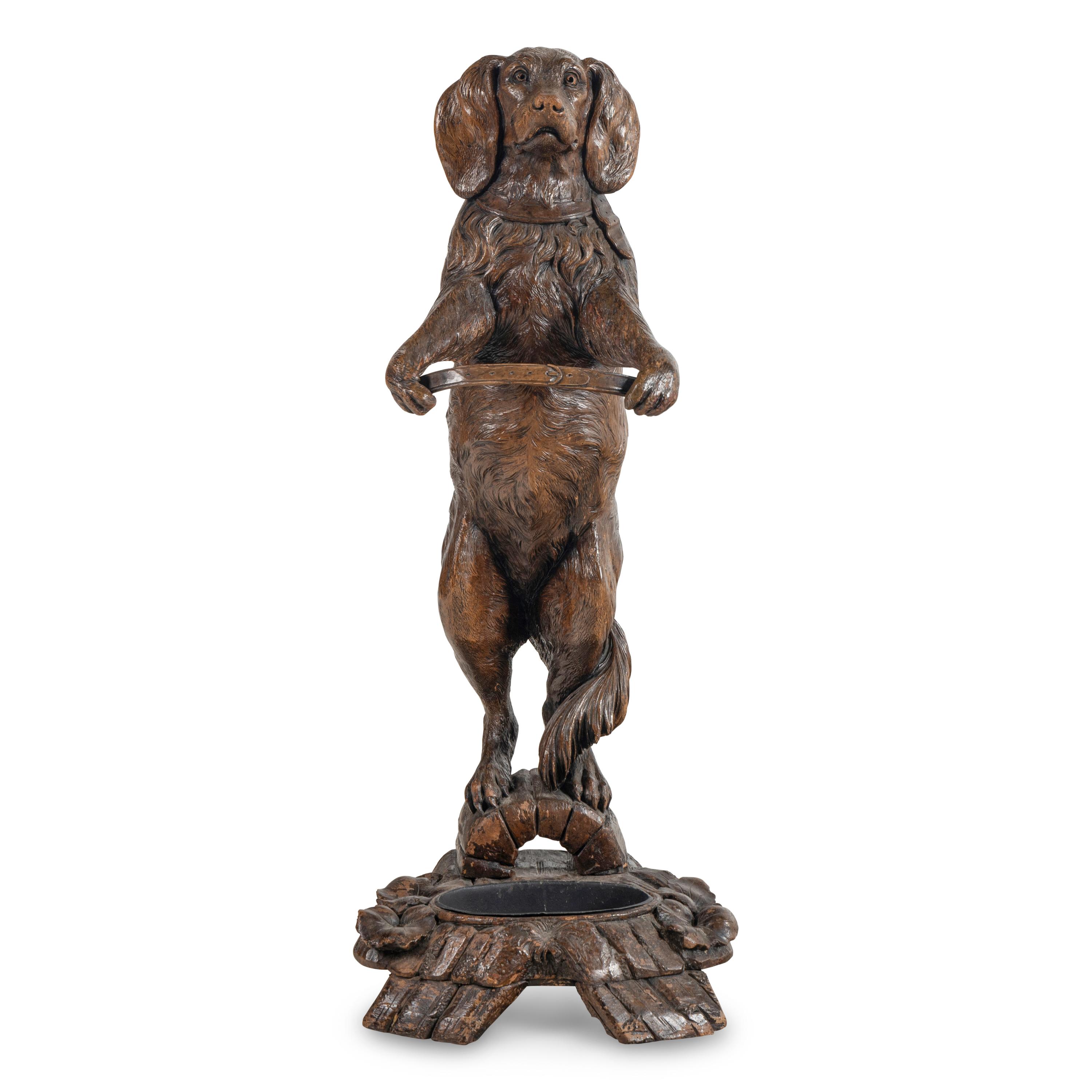 A Swiss "Black Forest" Carved Figural Umbrella Stand