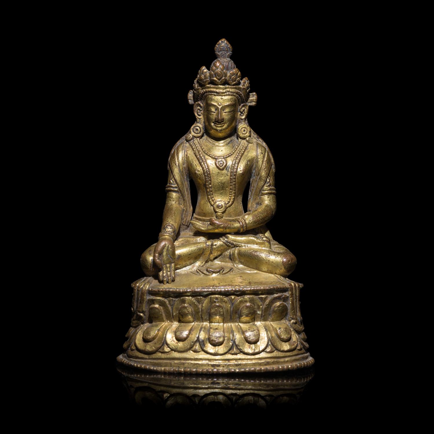 A Tibetan Gilt Copper Alloy Seated Figure of a Crowned Bodhisattva, 16th/17th Century 十六/十七世紀 西藏銅鎏金坐佛