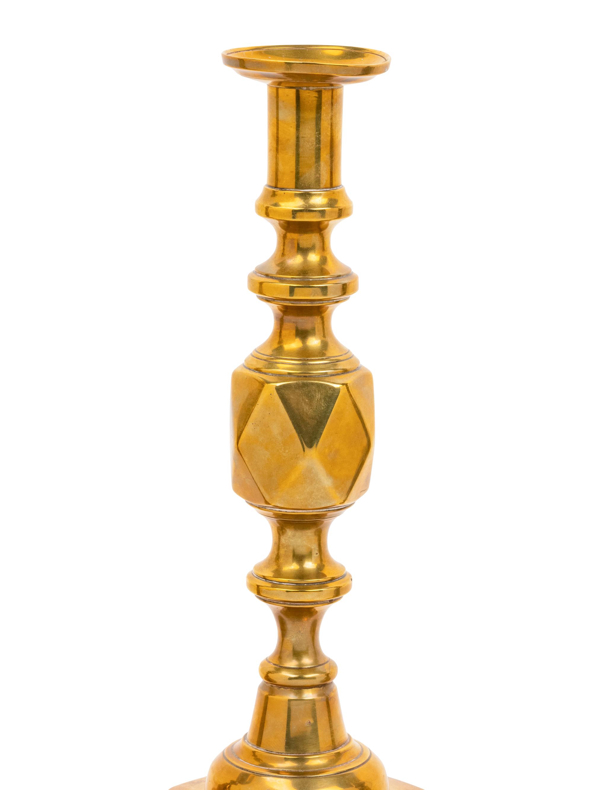 Three Pairs of English Brass Candlesticks