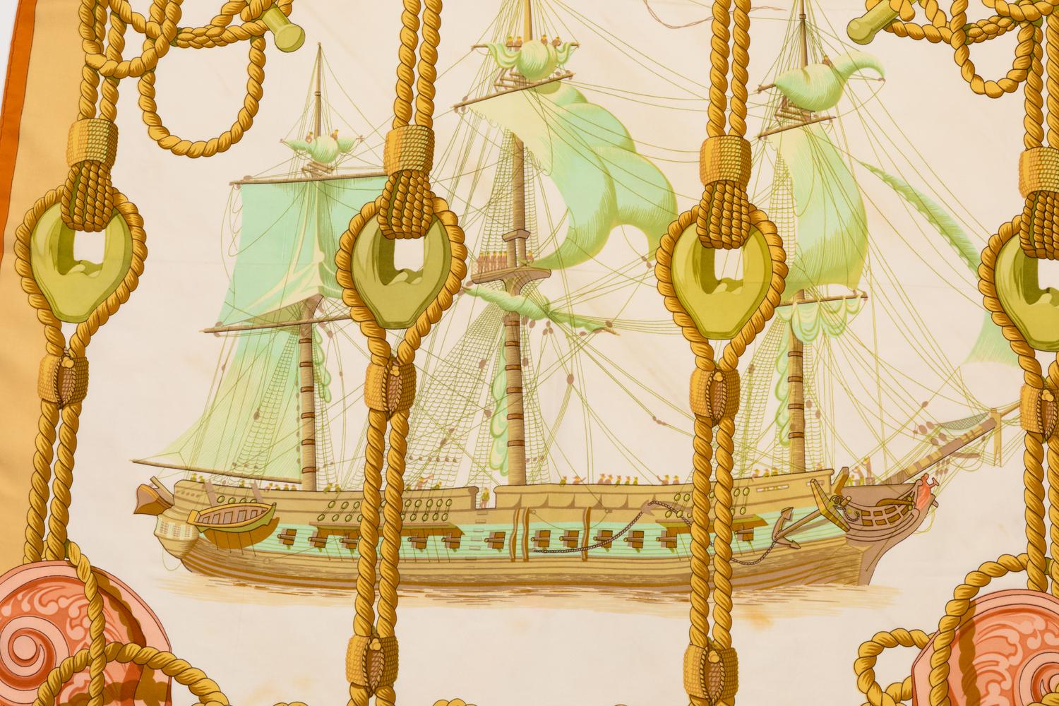 Hermes scarf, pink, green, and yellow with orange border.