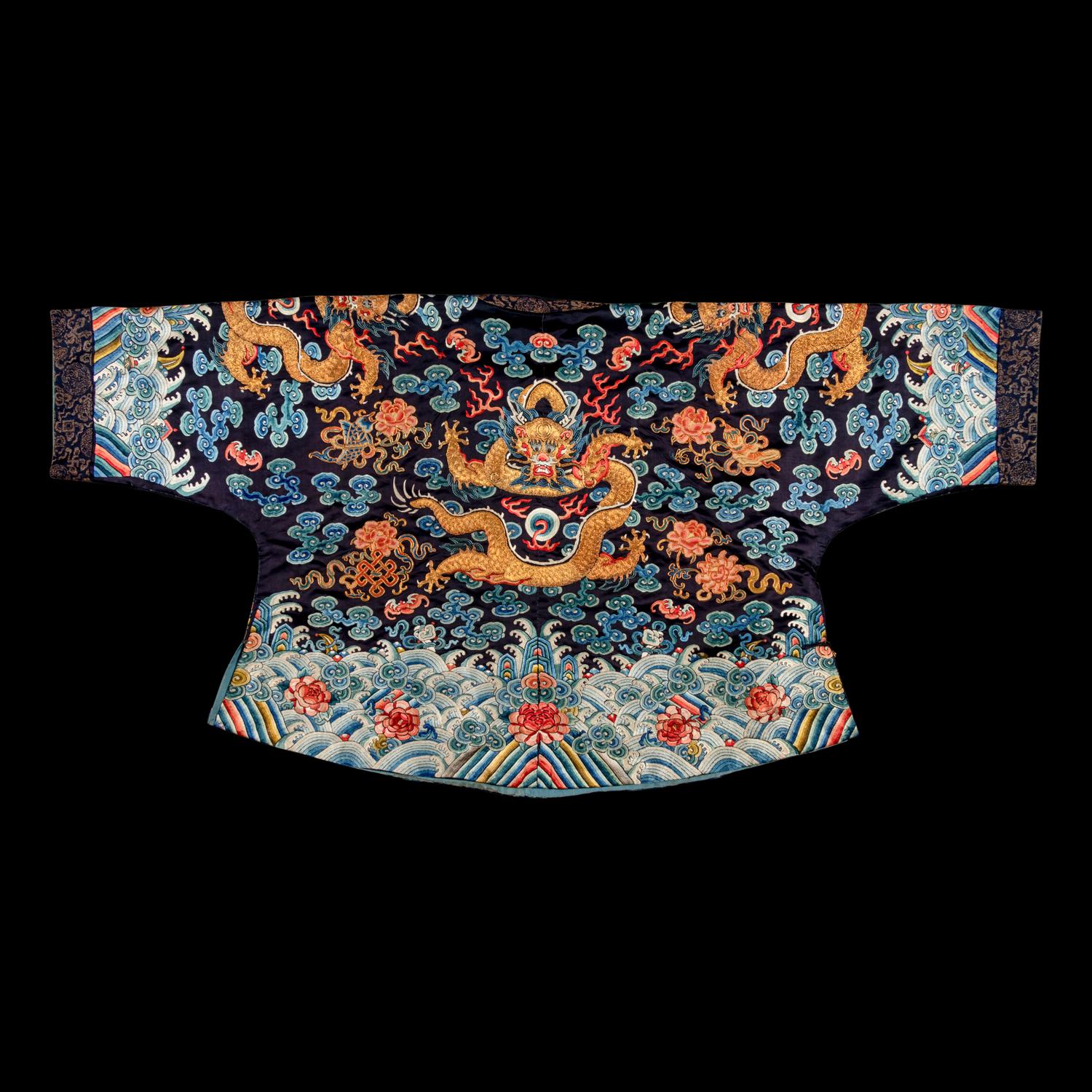 A Chinese Black Ground Embroidered Silk 'Dragon' Court Robe, Chaofugua, 19th Century 清晚期 黑緞地綉云龍紋朝服褂