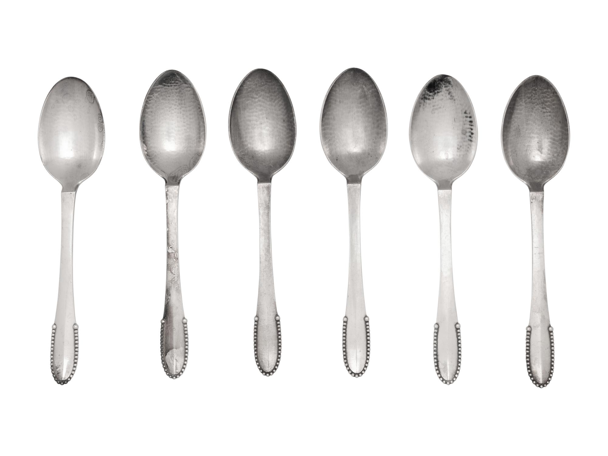 A Set of Six Georg Jensen Beaded Pattern Dessert Spoons