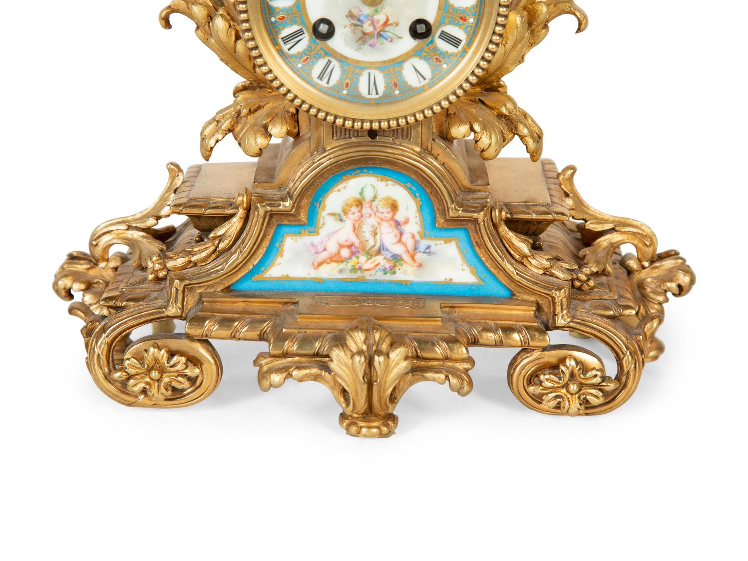A French Gilt Bronze and Sèvres Porcelain Clock Garniture