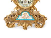 A French Gilt Bronze and Sèvres Porcelain Clock Garniture