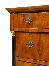 A Biedermeier Parcel Ebonized Walnut Commode