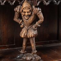 A Gothic Revival Carved Oak Court Cupboard