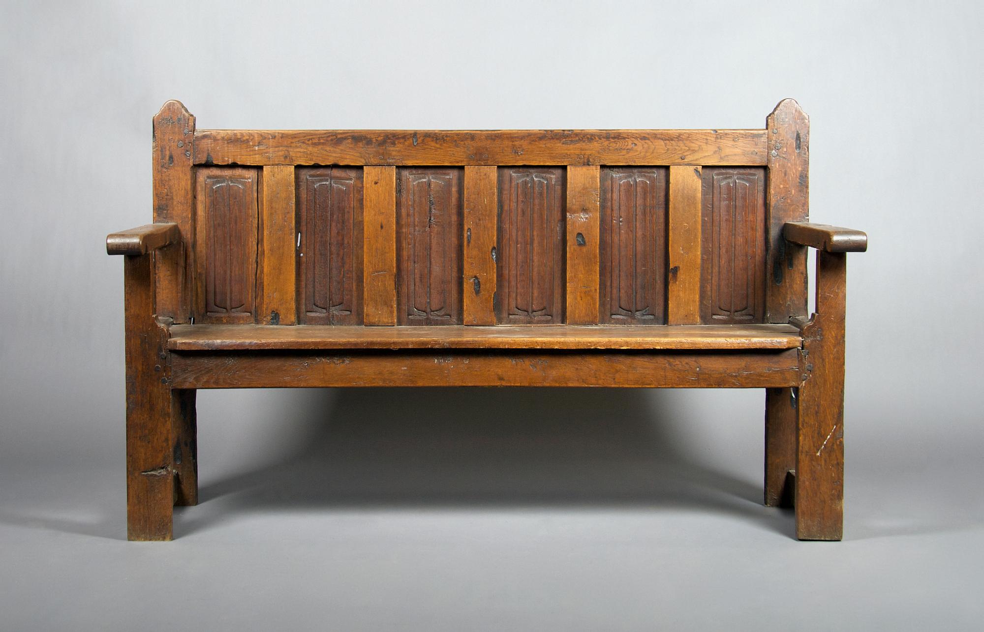 A Gothic Revival Oak Bench, Height 39 1/2 x width 65 3/4 x depth 20 inches.