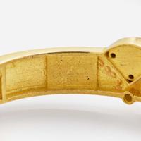 A Dan Alsberg 18K Yellow Gold and Gemstone Bangle