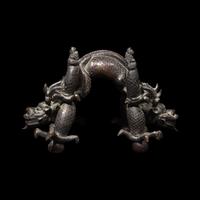 A Chinese Patinated Bronze Double Dragon Stand, Late Qing Dynasty 清晚期 青銅龍形座
