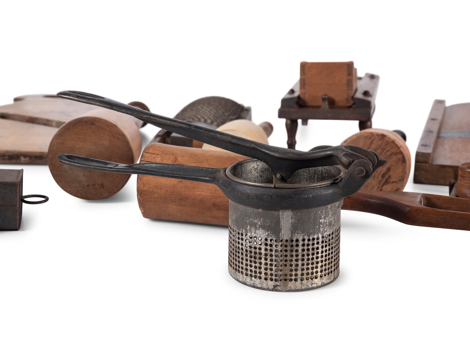 A Group of Wood and Tin Graters, Slicers and Pounders