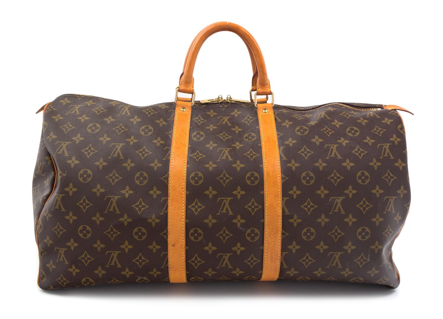 A Louis Vuitton Monogram Canvas Duffle Bag, 22" x 13" x 10".