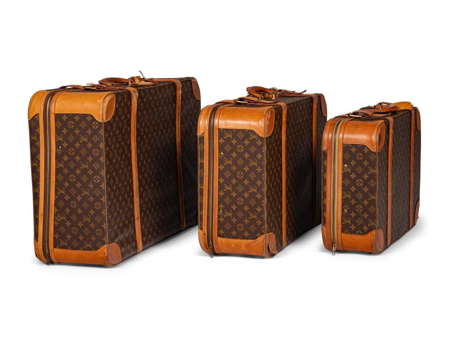 A Group of Three Louis Vuitton Soft-Sided Suitcases, 20th Century