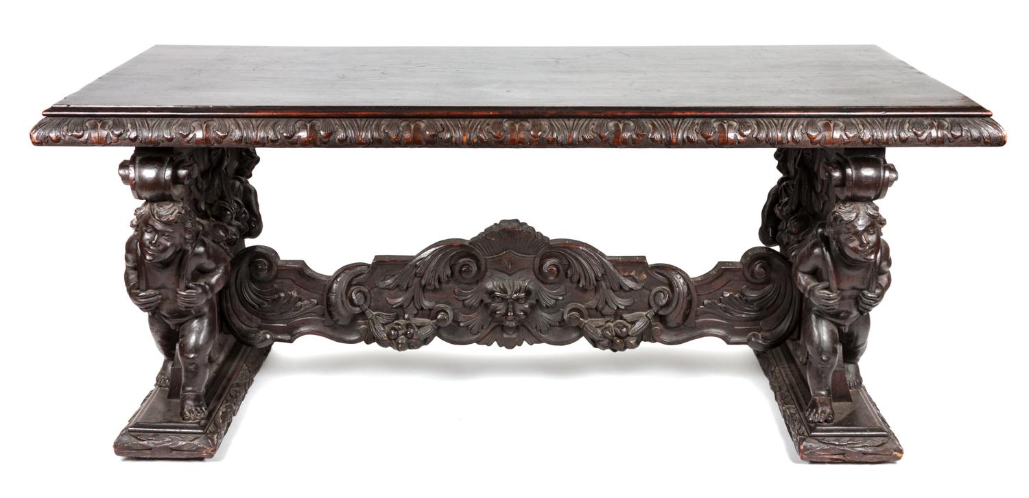 A Renaissance Revival Carved Library Table Height 32 x width 77 x depth 36 inches.