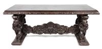 A Renaissance Revival Carved Library Table Height 32 x width 77 x depth 36 inches.