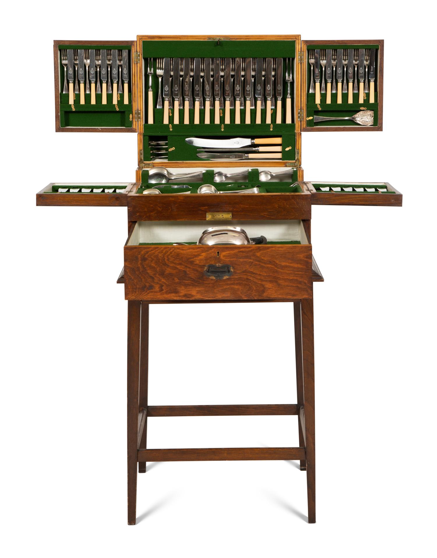 An Extensive Silver-Plate Flatware and Tea Service in a Fitted Wooden Case on Mahogany Stand